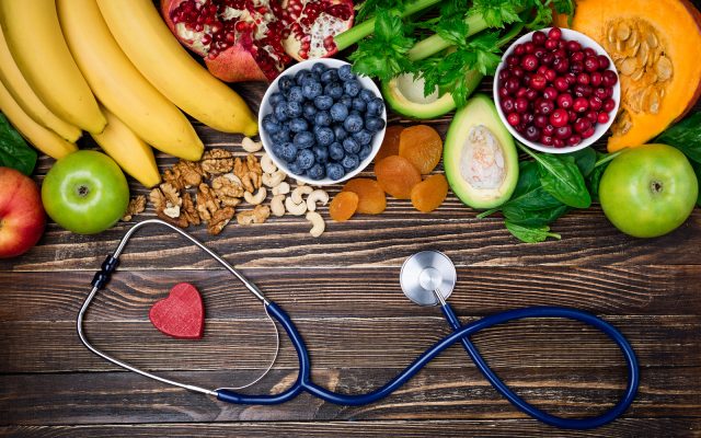 Background healthy food for heart. Healthy food, diet and life. Fresh fruits and vegetables, berries and nuts. Healthy heart concept